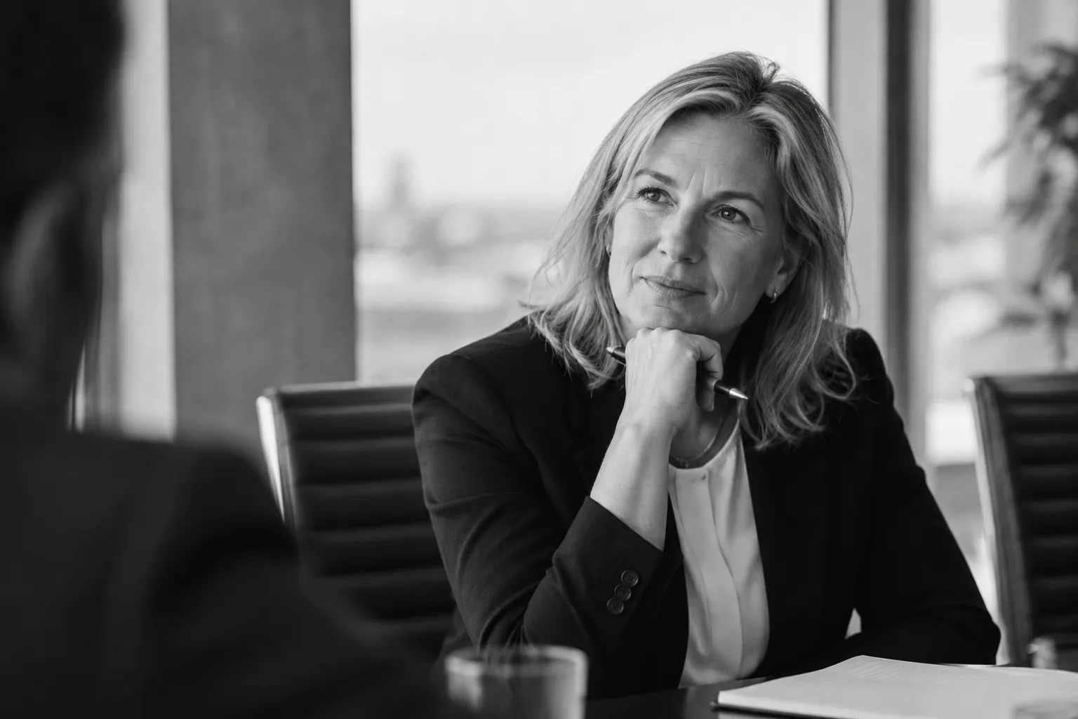 A colleague listening during a meeting